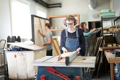 Converse students build a set for a theatre production